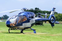 G-DEVL @ EGBT - being used for ferrying race fans to the British F1 Grand Prix at Silverstone - by Chris Hall