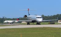 N914FJ @ ILM - CL 600 taxiing to gate with traffic taking off - by Mlands87