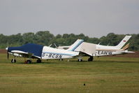 G-BCGN @ EGTK - parked alongside D-EAWW - by Chris Hall