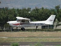 N137RJ @ POC - Fighting the cross winds while landing on runway 26L - by Helicopterfriend