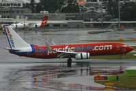 VH-VUA @ YSSY - onto a very wet 16R - by Bill Mallinson