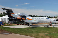 PT-PYV @ OSH - Embraer Phenom 300, c/n: 5050043 displayed at 2011 Oshkosh