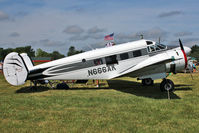 N666AK @ OSH - 1954 Beech E18S, c/n: BA-18 at 2011 Oshkosh - by Terry Fletcher