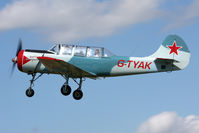 G-TYAK @ EGBR - Airfield resident Bacau Yak-52 performs during Breighton Airfield's Wings & Wheels Weekend, July 2011. - by Malcolm Clarke