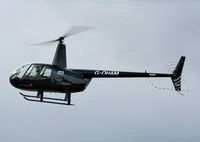 G-OHAM @ EGBJ - BBC TV  Top Gear presenter arriving at Staverton in his R44 - by Chris Hall