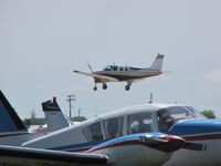 N4061S @ KOSH - landing rwy 09 EAA 2011 - by steveowen