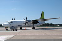 YL-BAW @ EVRA - AirBaltic Fokker 50 parked on the apron of Riga airport. - by Henk van Capelle