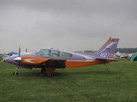 N2771 @ KOSH - colourful addition to a gray day @ EAA2011 - by steveowen