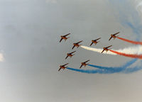 E25 @ MHZ - Alpha Jet number 1 of the Patrouille de France aerobatic display team leading the team in their display at the 1990 RAF Mildenhall Air Fete. - by Peter Nicholson