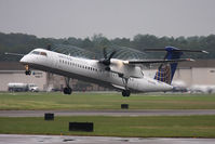 N34NG @ ORF - United Express (Colgan Air) N34NG (FLT CJC4890) departing RWY 5 en route to Newark Liberty Int'l (KEWR) with condensation from the propeller blade tips.