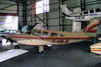 G-HMJB @ EGNH - inside the packed Blackpool Air Centre hangar - by Chris Hall