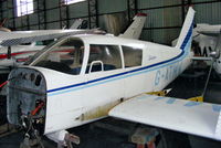 G-ATMW @ EGNH - inside the packed Blackpool Air Centre hangar - by Chris Hall