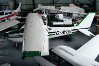 G-AYUV @ EGNH - inside the packed Blackpool Air Centre hangar - by Chris Hall
