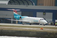 LX-LGK @ EGLC - Luxair Embraer 135LR London City Airport - by David Burrell