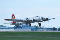 N5017N @ KOSH - Departing for the bomber flight