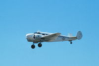 N6365T @ KDPA - C-45H 52-10687 flying past the tower - by Glenn E. Chatfield