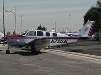N7204L @ POC - Parked in Howard Aviation parking area - by Helicopterfriend