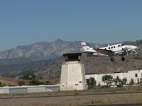 N905TF @ POC - Lifting off after passing the tower from runway 8R - by Helicopterfriend