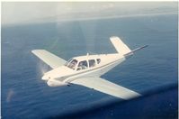 N1077B - Flying off the coast of Santa Barbara in the early 1960's with my father (Ken St.Oegger) at the controls. - by Unknown