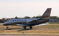 N777UT @ KAXN - Cessna 680 Citation Sovereign taxiing to runway 31.