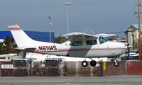 N611WS @ KSQL - 1975 Cessna T210L landing at San Carlos, CA - by Steve Nation