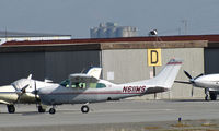 N611WS @ KSQL - 1975 Cessna T210L taxis at San Carlos, CA - by Steve Nation