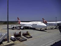 VH-OJA @ BNE - Pre-flight preparations at Brisbane prior to departure for Los Angeles.