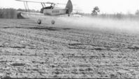 N55569 - Crop spraying in Brooks County GA. circa 1971. Pilot is John Kristl. 240 gal tank takes up front seat. No room for instrument panel so they were on the struts. - by Unknown
