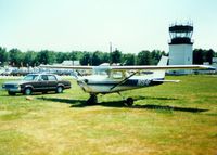 N1914F @ POU - 1966 Cessna 150M Aerobat N1914F and Control Tower at Dutchess County Airport, Poughkeepsie, NY - circa 1980's - by scotch-canadian