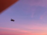 N663Y @ I73 - waco flying over i73 at sundown - by christian maurer
