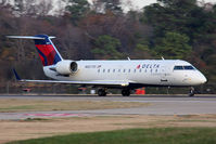 N8577D @ ORF - Delta Connection (Pinnacle Airlines) N8577D (FLT FLG4143) starting takeoff roll on RWY 23 en route to Boston Logan Int'l (KBOS). - by Dean Heald