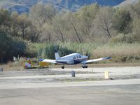 N8502N @ AJO - Pre-flighting at the holding area for runway 7 - by Helicopterfriend