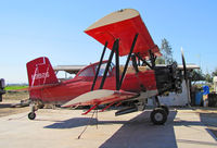 N9926 - Hughes Flying Service (Riverdale, CA) dark red 1974 G-164A rigged for spreading dry material @ Brian Hughes' airstrip - by Steve Nation