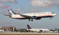 N404US @ MIA - US Airways 737 landing on 12 - by Florida Metal