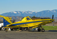 N502JS @ KWLW - Reg Michaud Aviation (Willows, CA) 1994 AT-502B rigged for spraying and framed by snow covered Coastal Range peaks while taking on load @ Willows, CA