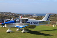 G-CGRO @ EGHE - G-CGRO, one of a flight of three DR400s visiting St Marys Isles of Scilly - view across Hugh Town to the Scillonian at the quay - by Pete Hughes