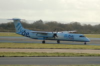 G-ECOB @ EGCC - Fybe De Havilland Canada DHC-8 taxxing Manchester Airport - by David Burrell