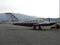 N6633T @ CNO - Parked on a very overcast day, with rain starting to fall - by Helicopterfriend