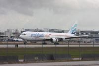 CS-TLZ @ MIA - Euro Atlantic Cargo from Portugal landing on 27 - taken from 94th Aero Squadron with clouds - by Florida Metal