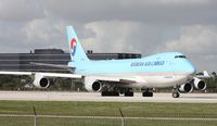 HL7601 @ MIA - After about 3 planes landed, the Korean 747 now cleared for take off on 9 - by Florida Metal