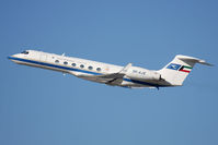 9K-AJE @ LAX - State of Kuwait 1999 Gulfstream G-V 9K-AJE (FLT KAC46) climbing out from RWY 25L en route to London Luton (EGGW). - by Dean Heald