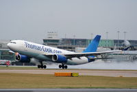 G-OMYT @ EGCC - missing the Thomas Cook logo on the tail after returning from lease with Garuda Indonesia - by Chris Hall