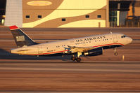 N802AW @ LAS - US Airways N802AW (FLT AWE101) departing RWY 1R en route to Los Angeles Int'l (KLAX). - by Dean Heald