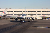 N189AN @ LAX - American Airlines N189AN (FLT AAL244) after pushback from the gate, preparing to taxi to RWY 25R for departure to Orlando Int'l (KMCO). - by Dean Heald