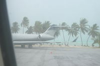 N118WT @ NTTB - parked at the Bora Bora airport, during a bit of rain. - by Ray