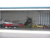 G-SBRK @ EGBK - Hangar contents at Sywell - note the Racing Car
