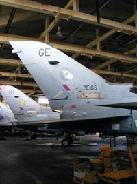 ZE165 @ EGOS - inside the Aircraft Maintenance & Storage Unit hangar - by Chris Hall