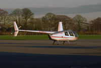 G-KELI @ EIWT - R.44 Parked on the ramp at Weston