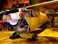 G-AEXD @ EGBK - at the rear of one of the hangars at Sywell - by Chris Hall