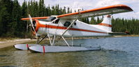 C-GWDW - C-GWDW on shores of Wollaston Lake, SK in the early 80's. Wollaston Lake Air had it here for a number of years - by Darrel Giesbrecht (Luke)